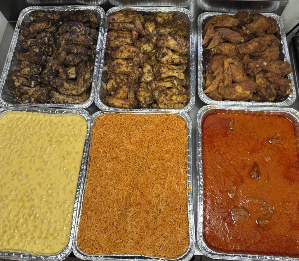 Fusion Vibes catering with jollof rice, mac n cheese, and fried wings