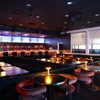 Dimly lit upscale lounge bar interior