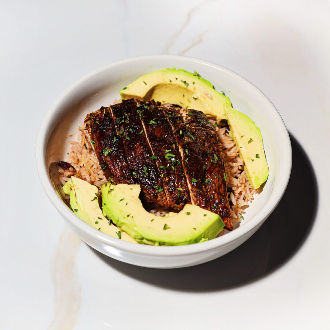Grilled steak bowl with rice and avocado
